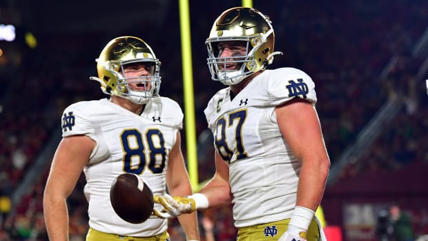 Notre Dame Fighting Irish tight end Michael Mayer (87) celebrates his touchdown scored against the Southern California Trojans with tight end Mitchell Evans (88) during the first half at the Los Angeles Memorial Coliseum.